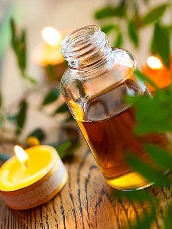 Image of essntial oils bottle and candle